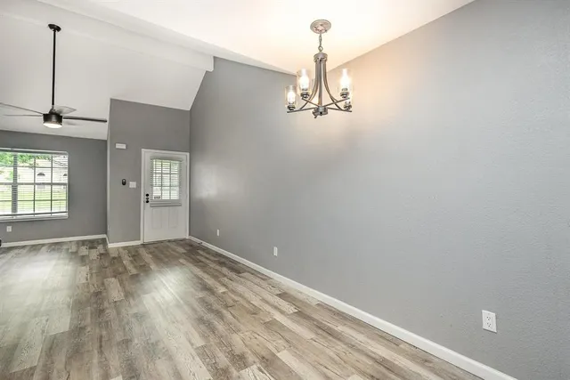 a view of empty room with windows