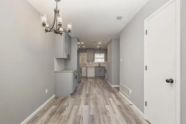 a view of a kitchen from the hallway