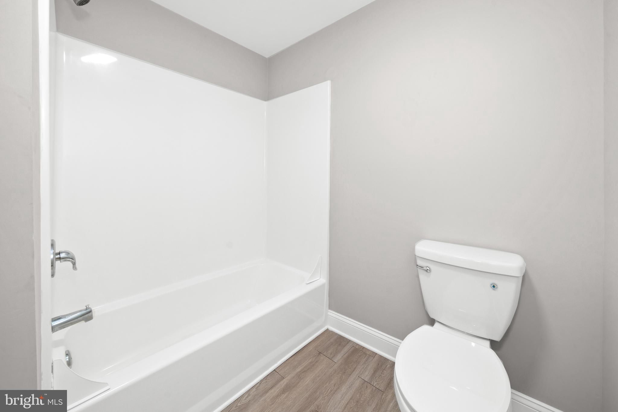 3000 Fountainview Circle, Unit 301 Newark, DE 19713 - Photo 12 of 17 a bathroom with a toilet and a bathtub