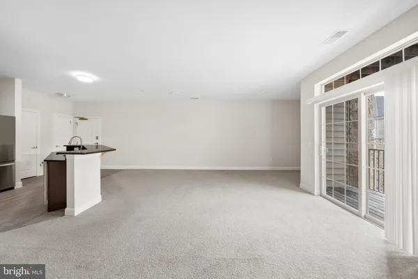 a kitchen with sink and window