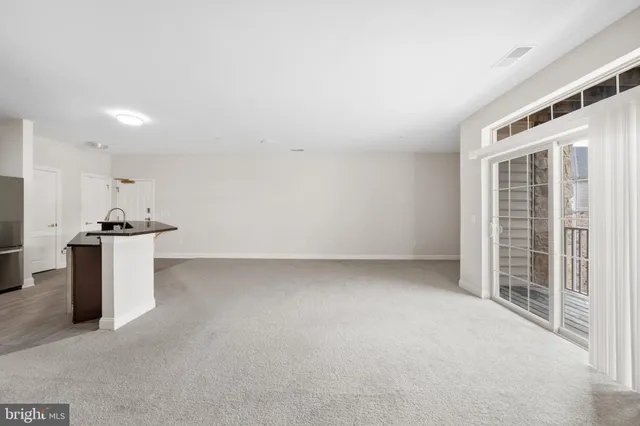 a kitchen with sink and window
