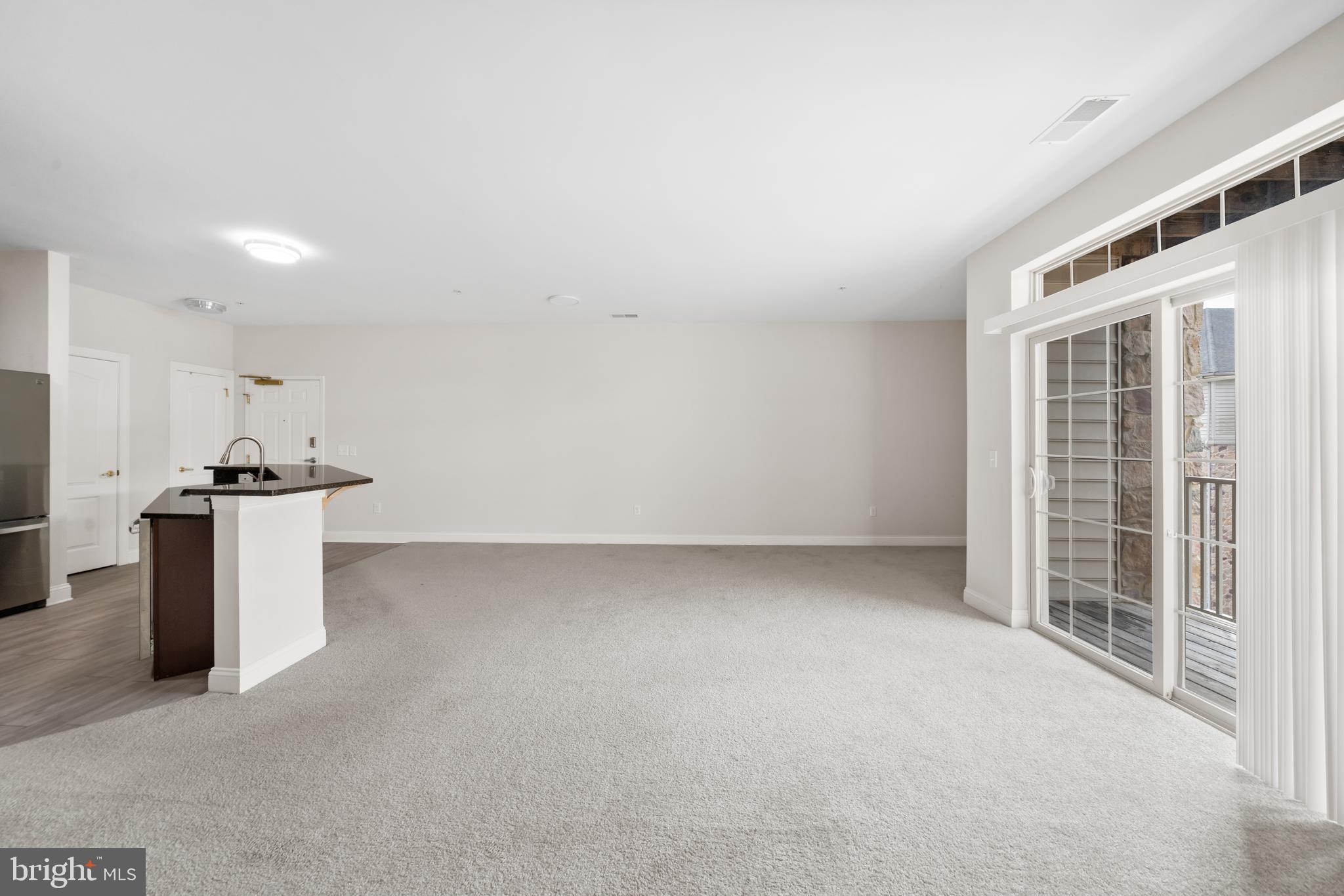 3000 Fountainview Circle, Unit 301 Newark, DE 19713 - Photo 4 of 17 a view of an empty room with a window