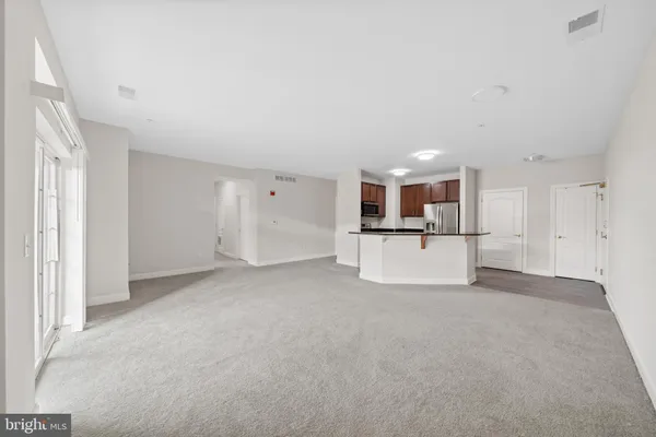 a kitchen with cabinets and stainless steel appliances