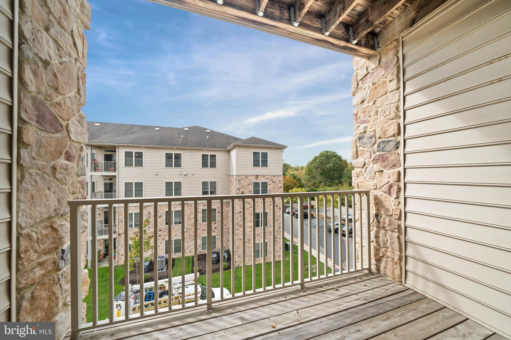 3000 Fountainview Circle, Unit 301 Newark, DE 19713 - Photo 9 of 17 a view of a balcony with wooden floor