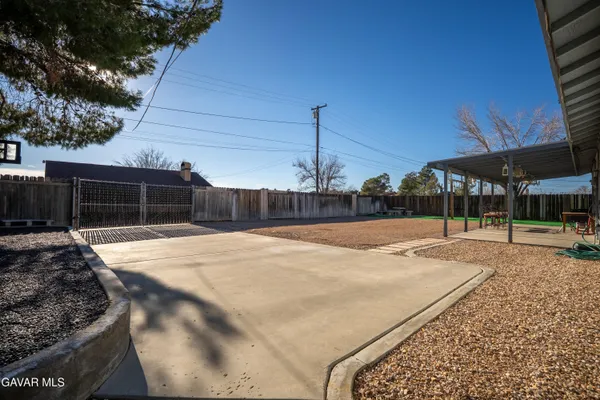 a view of a backyard with sitting area