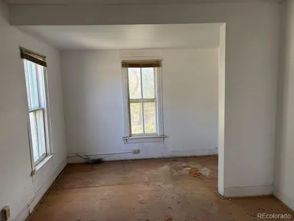 an empty room with windows