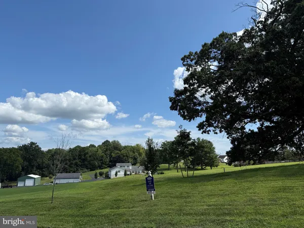 a front view of a house with a big yard