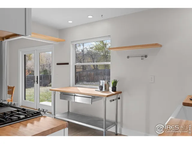 a room with a wooden floor and a table