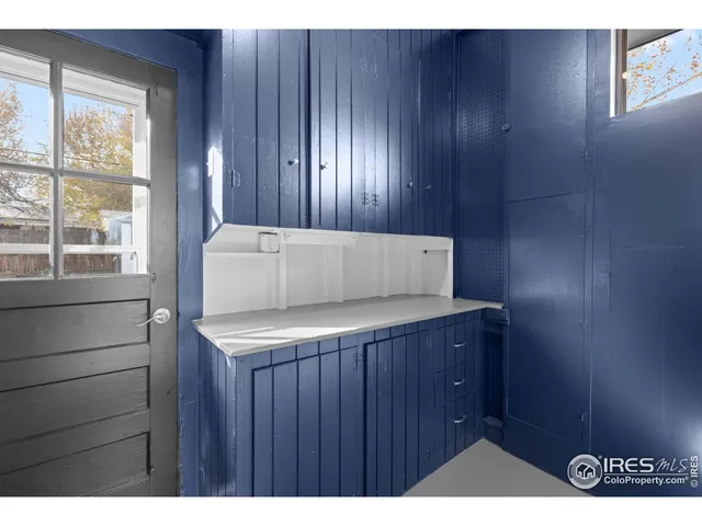 a kitchen with a wooden floor