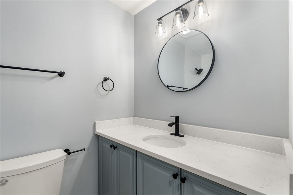 5 Main Street, Unit 5 Boston, MA 02129 - Photo 11 of 19 a bathroom with a sink and a mirror