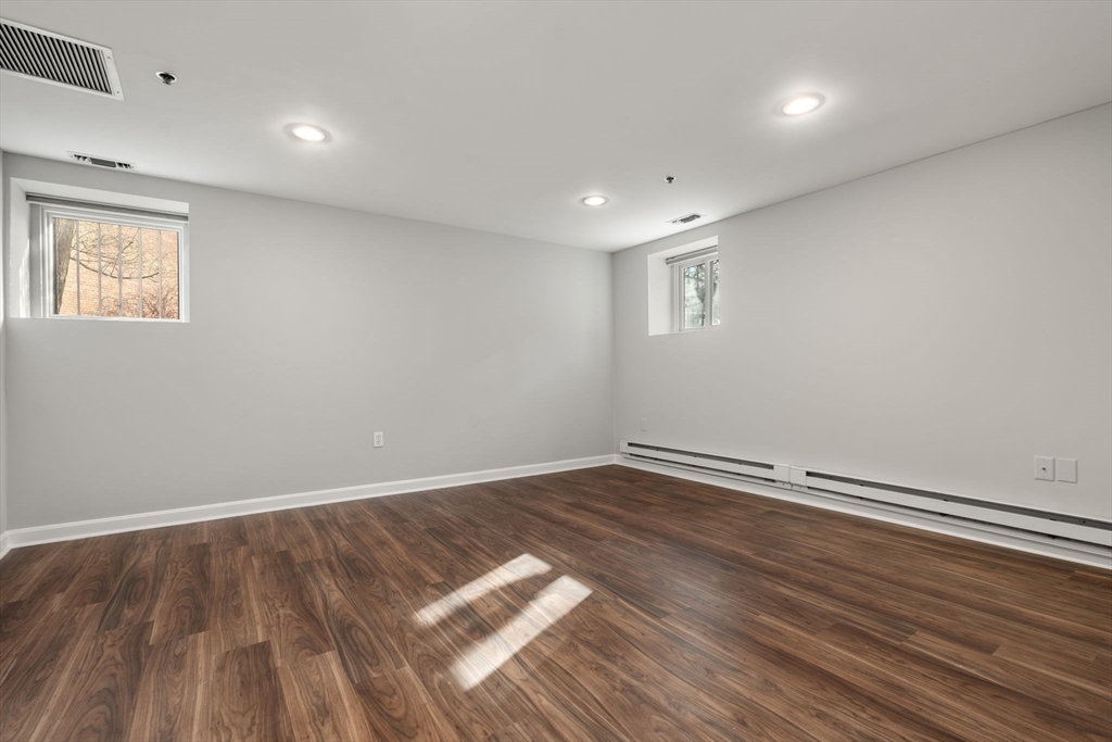 5 Main Street, Unit 5 Boston, MA 02129 - Photo 14 of 19 a view of empty room with wooden floor