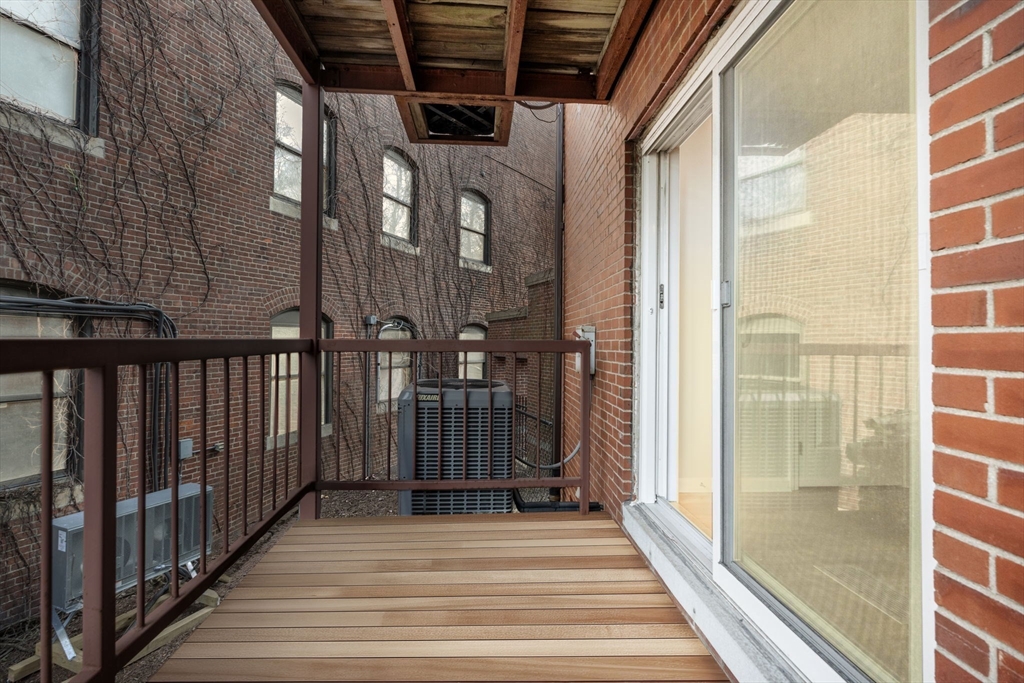 5 Main Street, Unit 5 Boston, MA 02129 - Photo 17 of 19 a view of a balcony with wooden floor