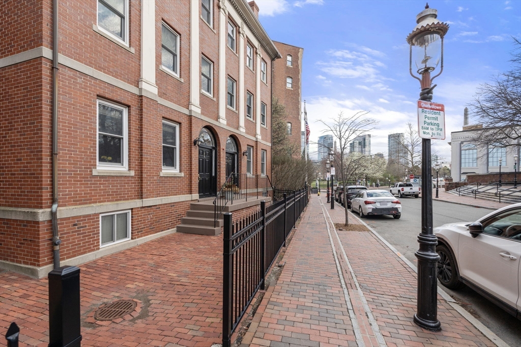 5 Main Street, Unit 5 Boston, MA 02129 - Photo 18 of 19 a city street lined with buildings and cars