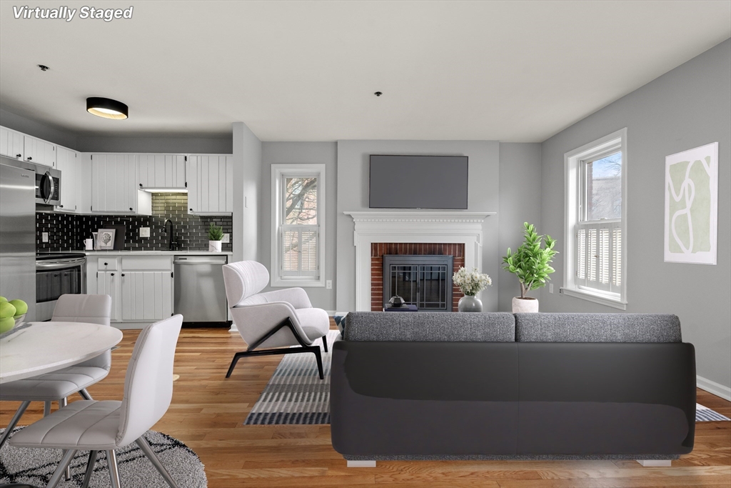 5 Main Street, Unit 5 Boston, MA 02129 - Photo 4 of 19 a living room with furniture and a fireplace