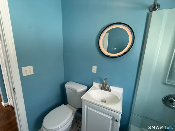 a bathroom with a toilet and a sink