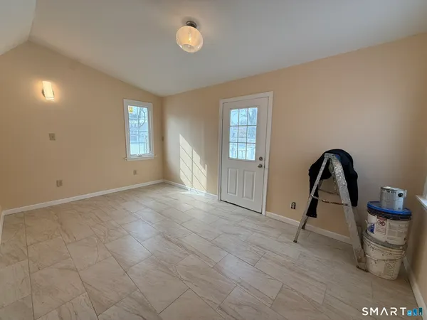 a view of an empty room with a window