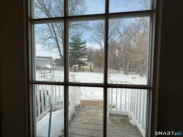 a view of a room with wooden floor and chair