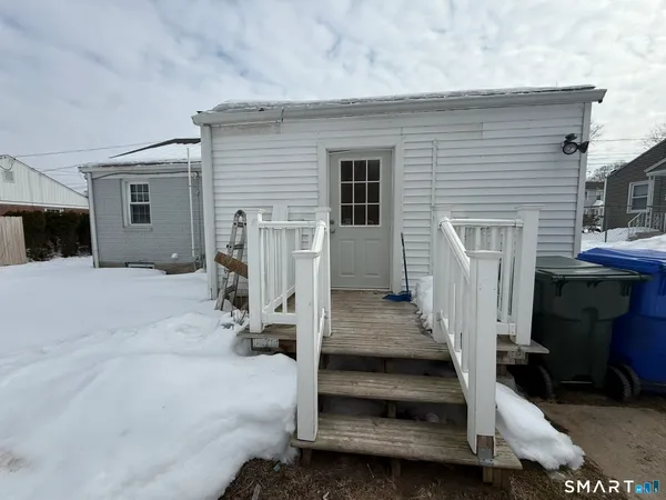 a view of backyard with seating space