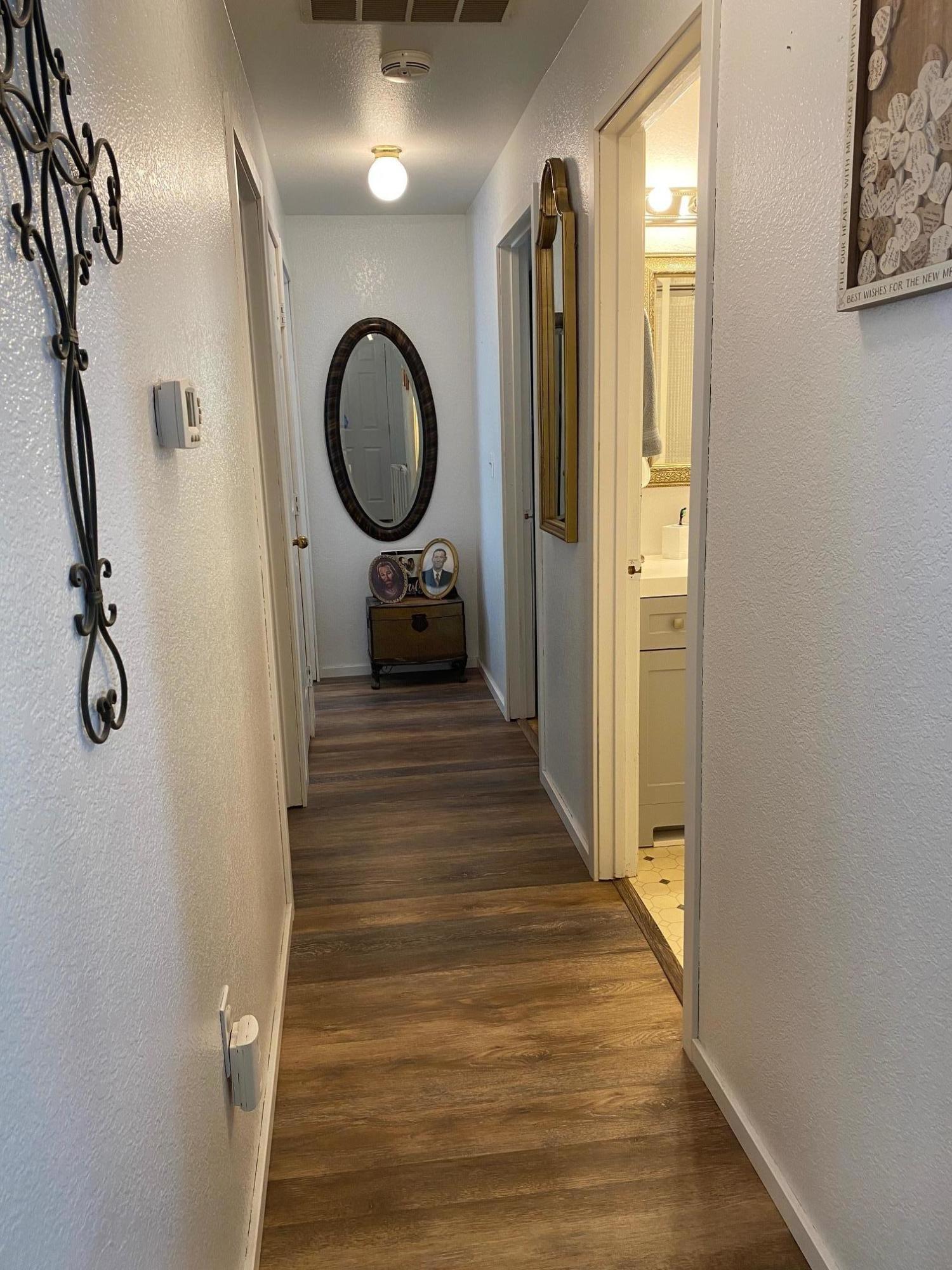 1260 Beffa Road Tieton, WA 98947 - Photo 15 of 38 a view of a hallway with wooden floor and staircase