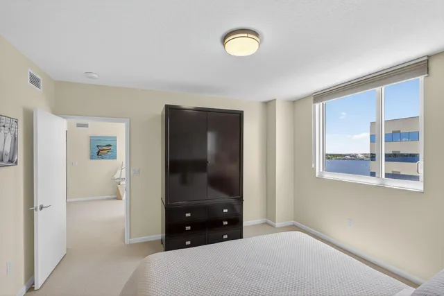 a bedroom with a bed and a television