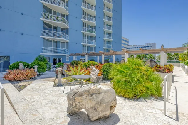 a view of swimming pool with outdoor seating and a yard