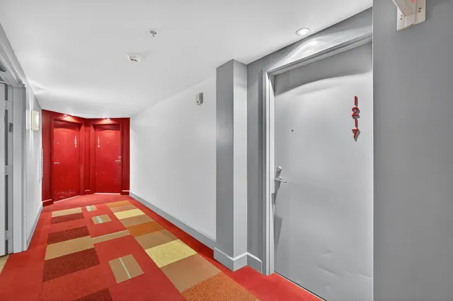 a view of hallway with windows