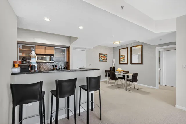 a kitchen with a table and chairs in it