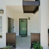 a view of front door and potted plants
