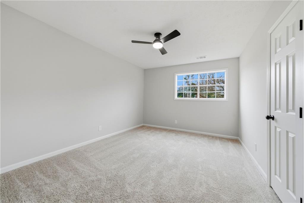 7258 Banks Mill Road Douglasville, GA 30135 - Photo 12 of 23 a view of an empty room with a window
