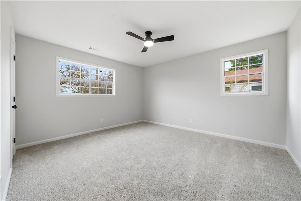 7258 Banks Mill Road Douglasville, GA 30135 - Photo 15 of 23 a view of an empty room with a window