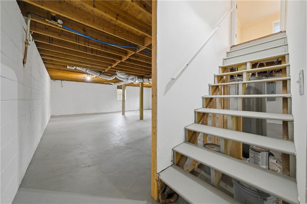 7258 Banks Mill Road Douglasville, GA 30135 - Photo 17 of 23 a view of staircase with wooden floors and a window