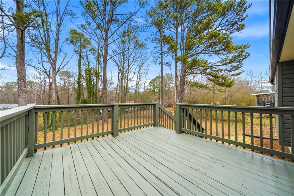 7258 Banks Mill Road Douglasville, GA 30135 - Photo 20 of 23 a view of balcony with wooden floor and fence