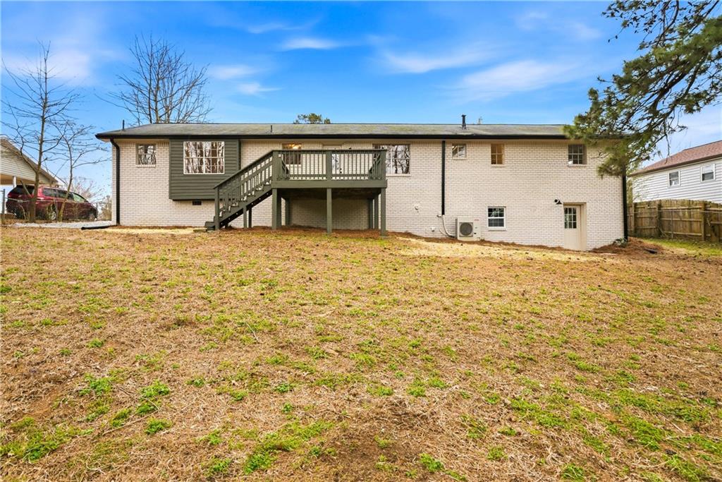 7258 Banks Mill Road Douglasville, GA 30135 - Photo 23 of 23 a front view of a house with a yard