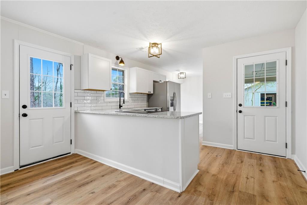 7258 Banks Mill Road Douglasville, GA 30135 - Photo 5 of 23 a view of kitchen with wooden floor