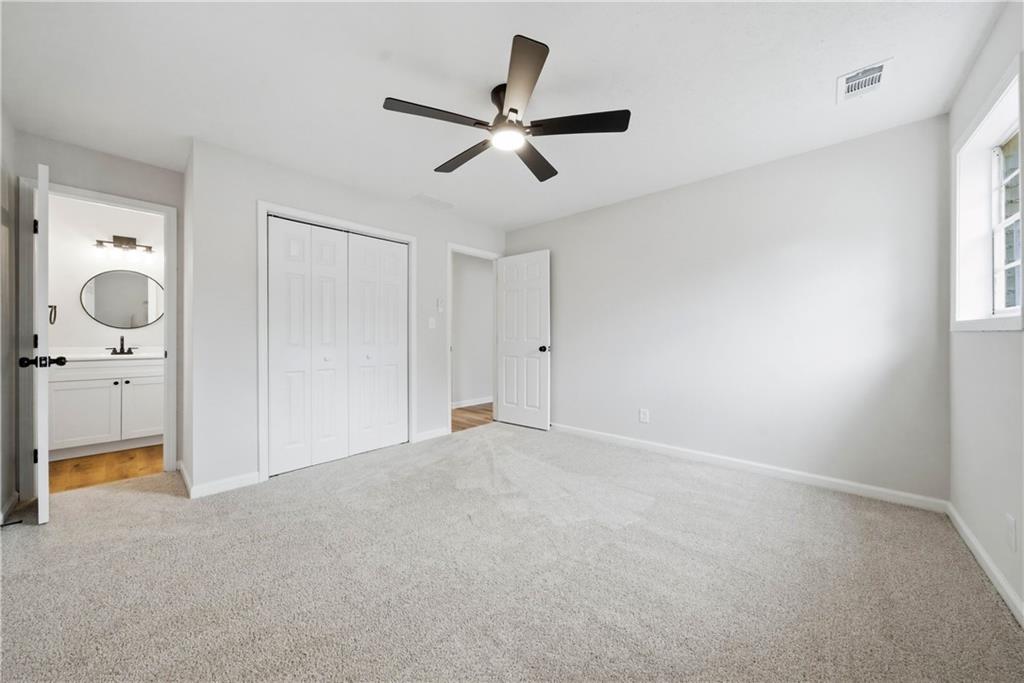 7258 Banks Mill Road Douglasville, GA 30135 - Photo 10 of 23 wooden floor in an empty room with a window