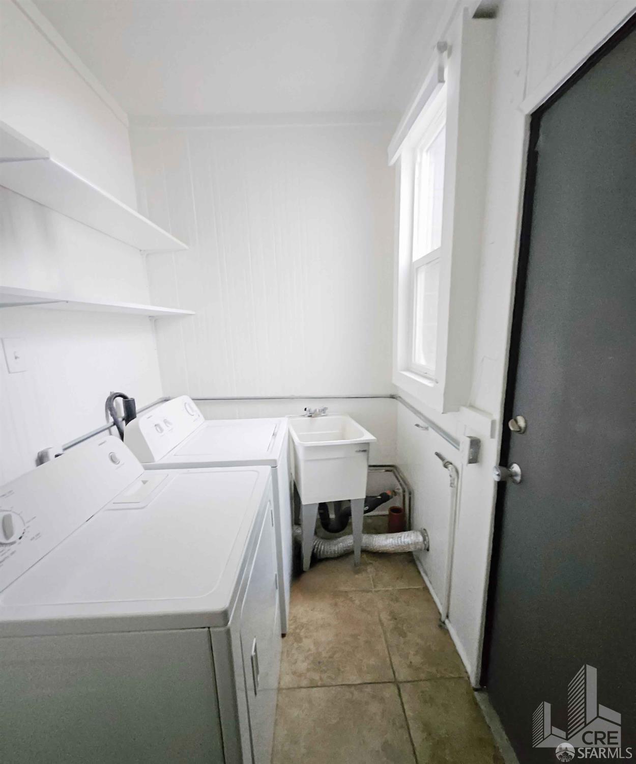 66-68 Moss Street San Francisco, CA 94103 - Photo 7 of 8 a utility room with dryer and washer