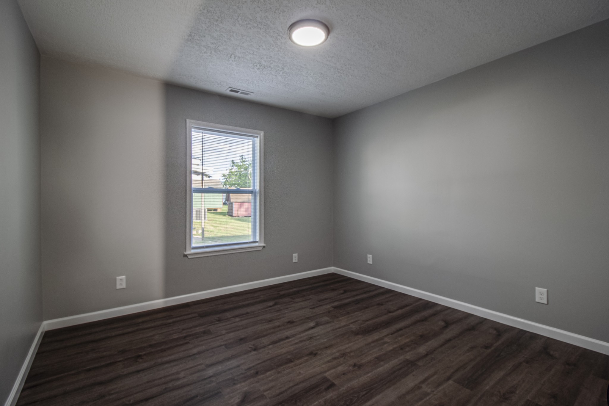 121 Popular Street North Cowan, TN 37318 - Photo 20 of 46 a view of an empty room with wooden floor and a window