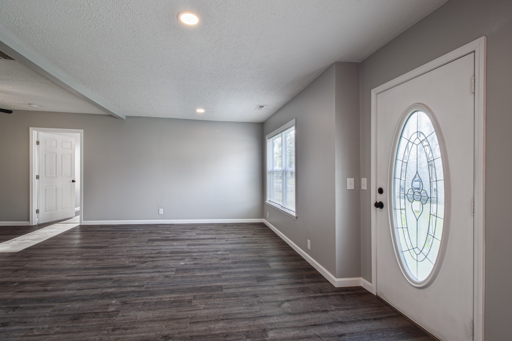 121 Popular Street North Cowan, TN 37318 - Photo 3 of 46 wooden floor in an empty room with a window