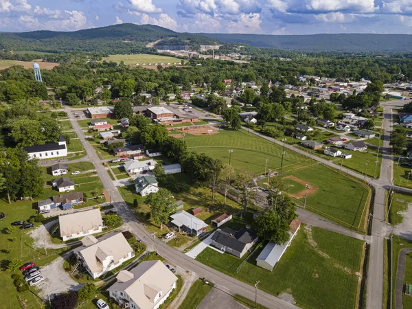 an aerial view of residential houses with outdoor space