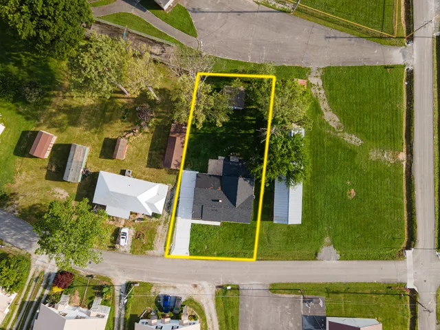 an aerial view of houses with yard