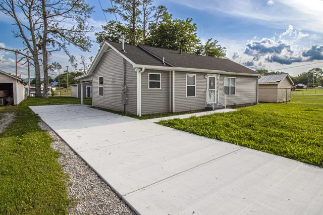 a backyard of a house with lots of green space