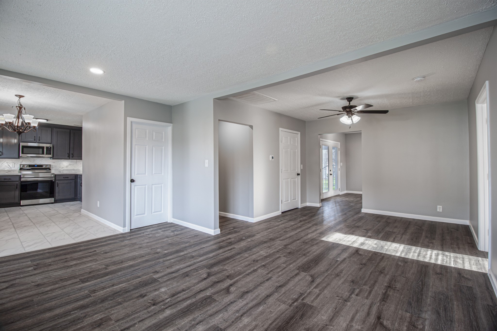 121 Popular Street North Cowan, TN 37318 - Photo 5 of 46 a view of an empty room with wooden floor