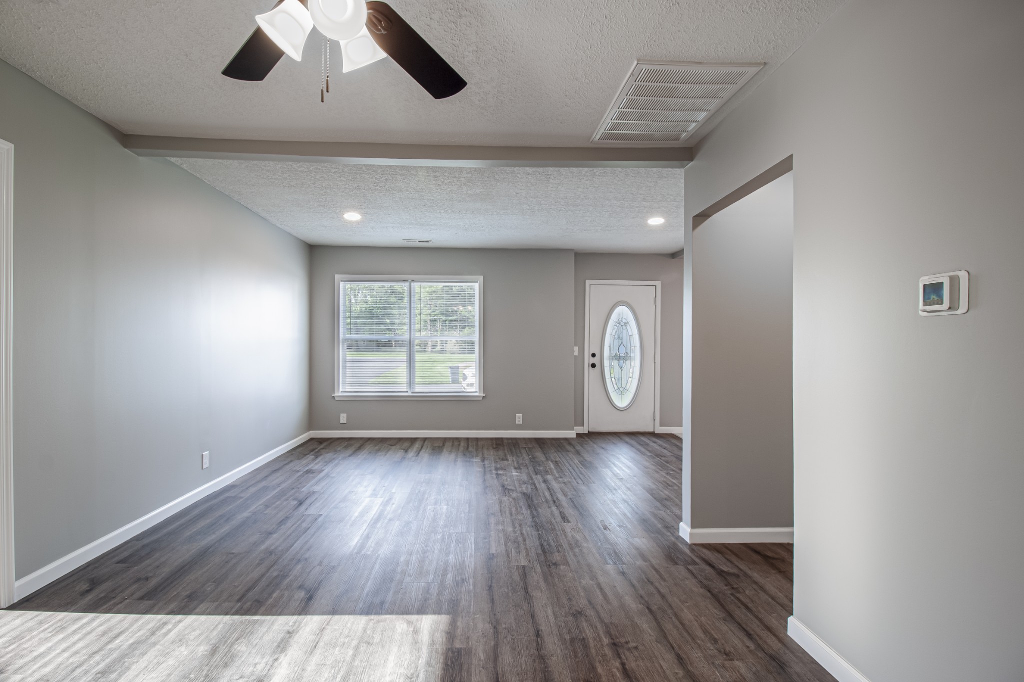 121 Popular Street North Cowan, TN 37318 - Photo 7 of 46 wooden floor in an empty room with a window