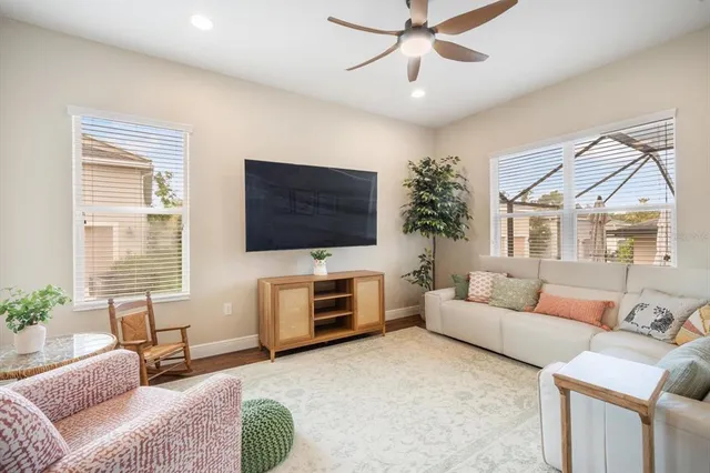 a living room with fireplace furniture and a flat screen tv
