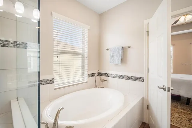 a white bath tub sitting next to a white sink