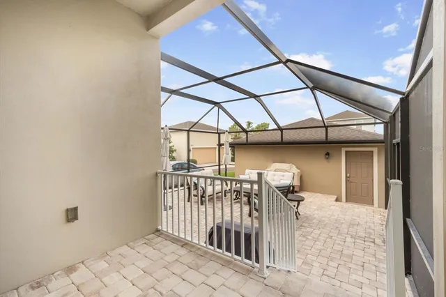 a building outdoor space with patio furniture and potted plants