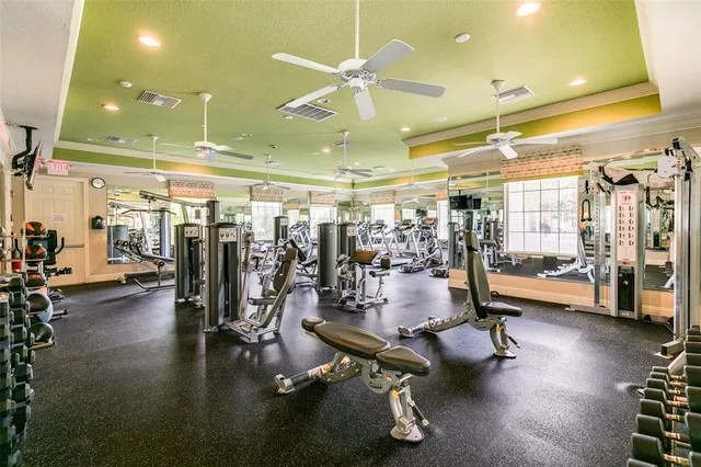 aerial view of a brick building next to a yard