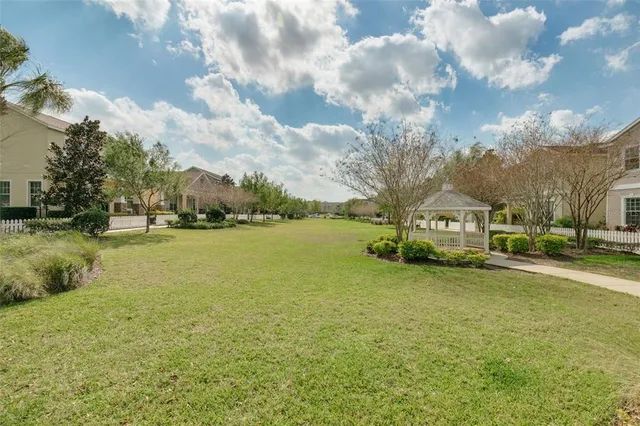 a view of a street that has couple of cars parked on the road