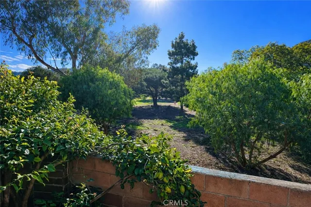 a view of balcony and yard
