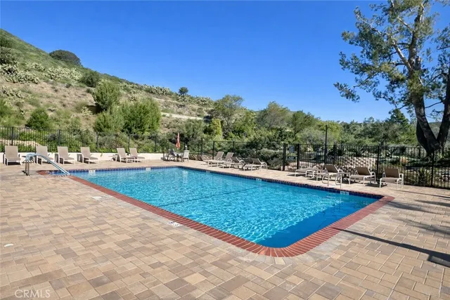 a view of a swimming pool with a patio